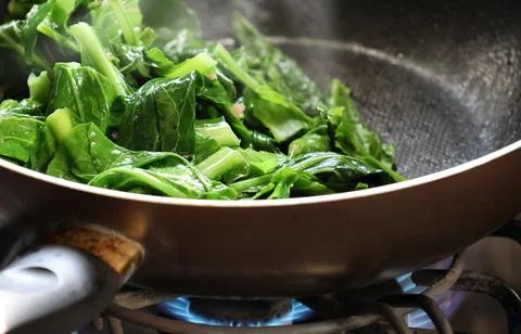 Selective focus stir fried vegetables cooking on the gas stove homemade in .. Stock Photos