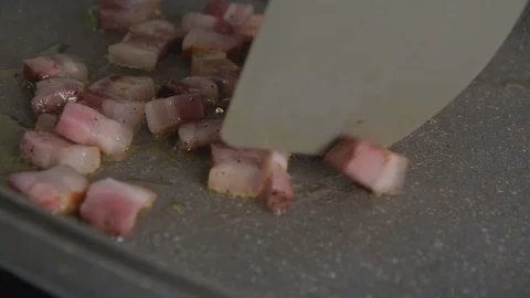 Selective focus. Stirring of fried bacon, close up Stock Footage 123803975