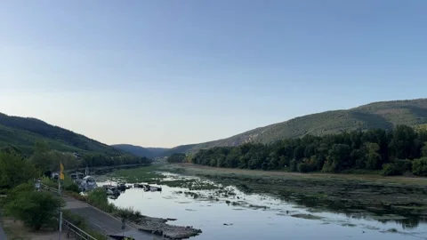 Selective focus stunning Rhine River panorama beneath lush green mountains Stock Footage 345592263