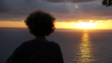 Selective focus on sun path on ocean surface at sunset. Calm video of young Video stock 253579067