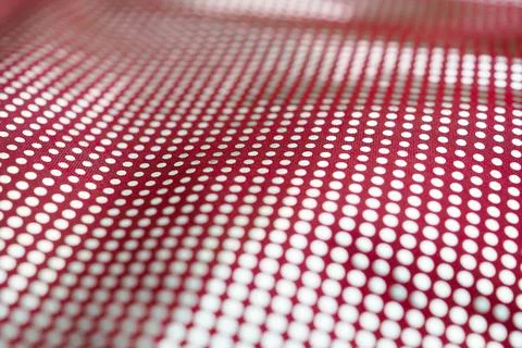 Selective focus on the surface of a red textile fabric with a pattern of silvery Stock Photos
