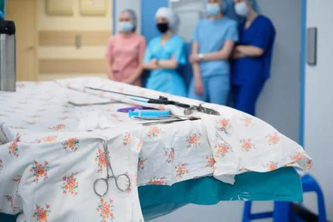 Selective focus on a surgical clamp on a table with other instruments. Stock Photos
