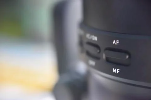 Selective focus on switch of auto and manual focus on the lense Stock Photos