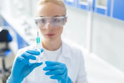 Selective focus of a syringe Stock Photos