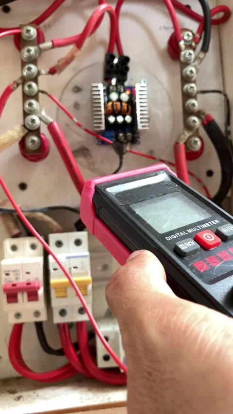 Selective Focus Of A Technician's Hand Holding A Digital Multitester Stock-Footage 345864945