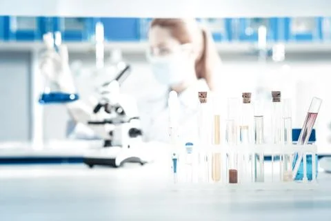 Selective focus of test tubes standing in the rack 스톡 사진