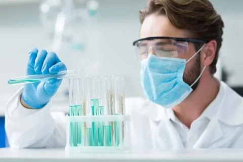 Selective focus of test tubes standing on the shelf Stock Photos
