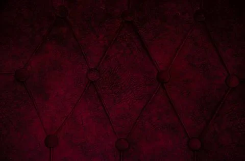 Selective focus texture of velour sofa with buttons. Fabric surface. Stock Photos