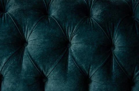 Selective focus texture of velour sofa with buttons. Foto stock