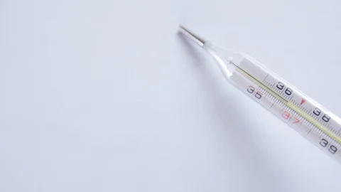 Selective focus on Thermometer on white background 4k video. Vidéo 122346764