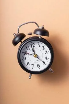 Selective focus. a ticking black clock Stock Photos