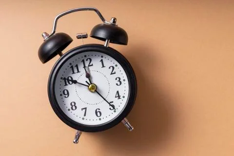 Selective focus. a ticking black clock Stock Photos