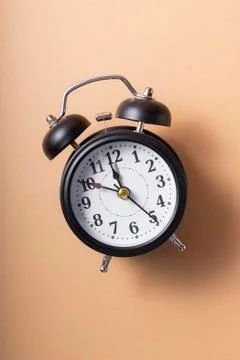 Selective focus. a ticking black clock Stock Photos