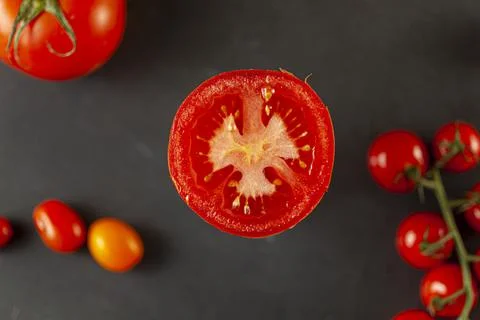 A selective focus, top view close up image of a sliced half Roma tomato Stock Photos