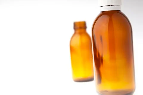 Selective focus two medicine bottles close up isolated on white Stock Photos