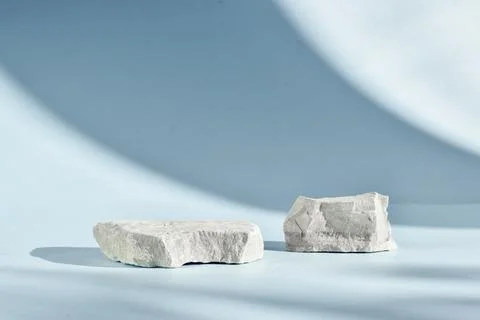 Selective focus. Two stone catwalks on a light blue background with beautiful Stock Photos