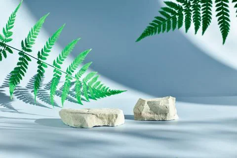 Selective focus. Two stone catwalks on a light blue background with beautiful Stock Photos