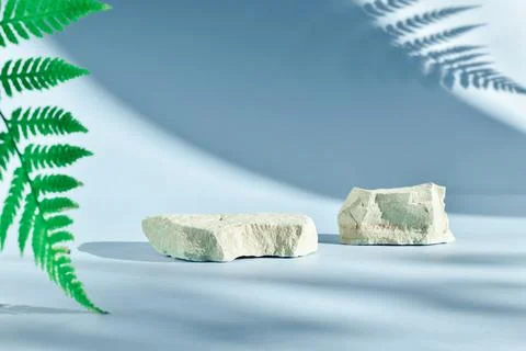Selective focus. Two stone catwalks on a light blue background with beautiful Stock Photos
