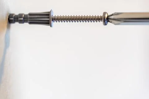 Selective focus on a typical drywall anchor installation . Stock Photos