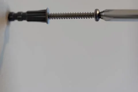 Selective focus on a typical drywall anchor installation . Foto stock