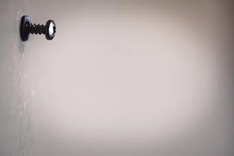 Selective focus on a typical drywall anchor installation . Foto stock