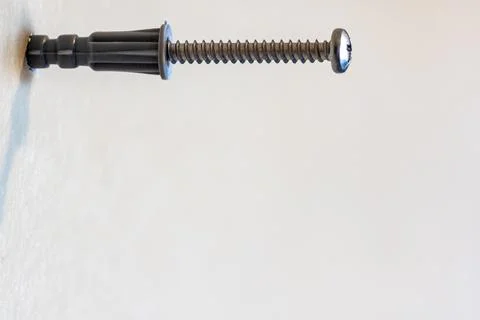 Selective focus on a typical drywall anchor installation . Foto stock