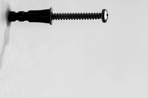 Selective focus on a typical drywall anchor installation . Stock Photos
