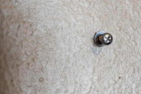 Selective focus on a typical drywall anchor installation . Stock Photos