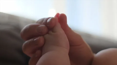 Selective focus of unrecognizable caring young mom massaging arm Stock Footage 253813298