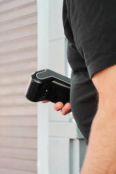 Selective focus on unrecognizable waiter with a payment terminal in his hand Stock Photos