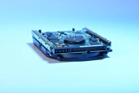Selective focus. Used hard disk isolated on white background and blue backlig Stock Photos
