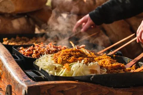 Selective focus on vegetables in large pans, hot dishes the open-air market Stock Photos