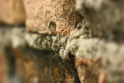 Selective focus of very old brown brick wall Stock Photos