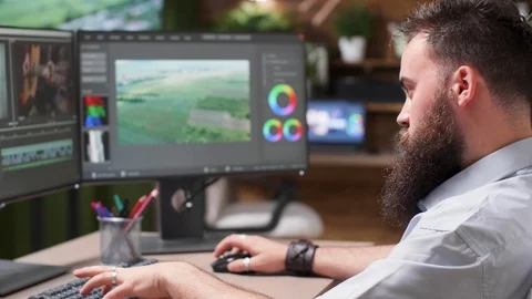 Selective focus on video editors face working in creative media agency Stock Footage 110494705