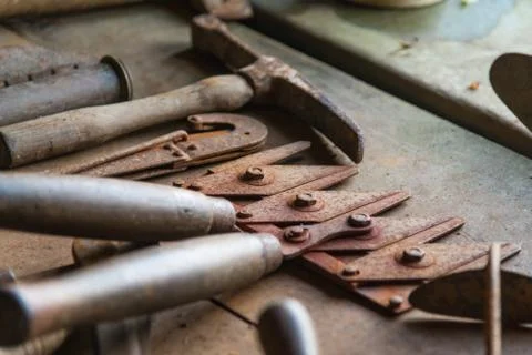 Selective focus view of old gardening tools lying on a bench Stock Photos