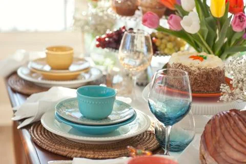 Selective focus view of spring table settings with tulips Stock Photos