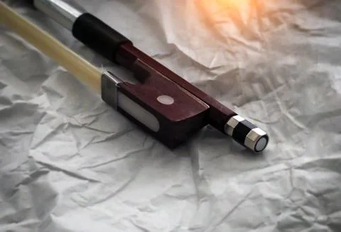 In selective focus of violin bow frog and violin bow screw,the end part of a  Stock Photos