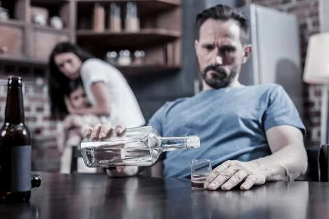 Selective focus of vodka being poured into the glass Stock Photos