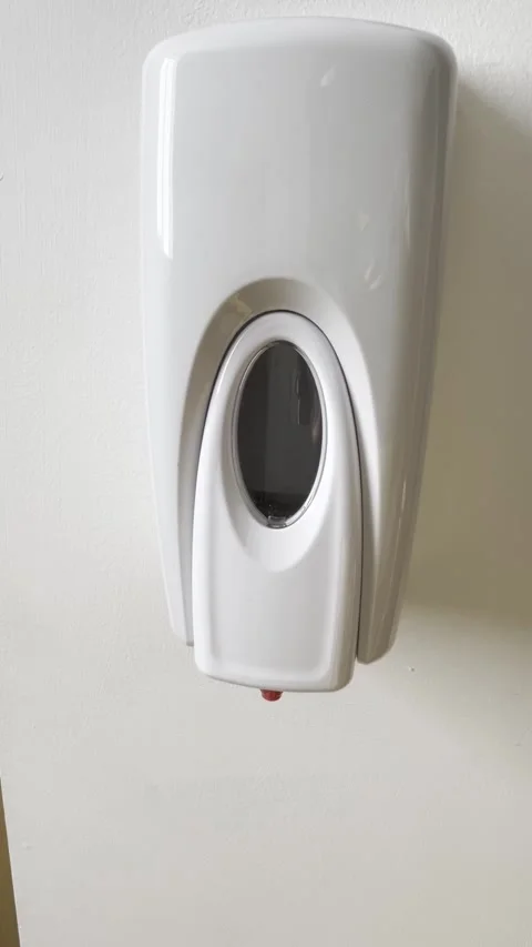 Selective focus on wall-mounted hand sanitizer dispenser in office Stockbeeldmateriaal 313713891