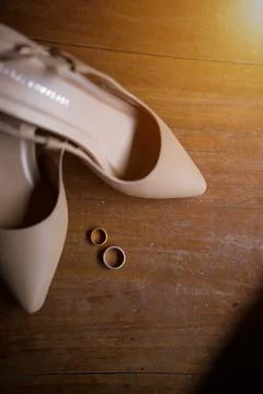 Selective focus on wedding attributes like heeled shoes Stock Photos