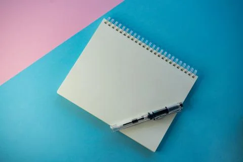 Selective focus, white blank Notepad under copyspace, on colored background Stock Photos