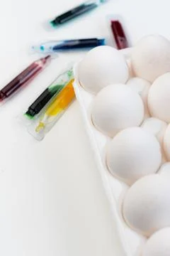 Selective focus, white chicken eggs with dye Stock Photos