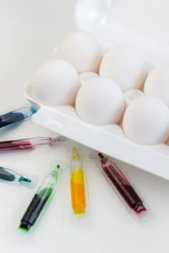 Selective focus, white chicken eggs with dye Stock Photos