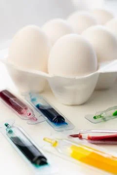 Selective focus, white chicken eggs with dye Stock Photos