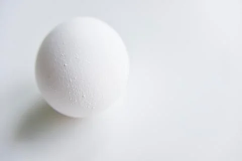 Selective focus at the white egg in the hand Stock Photos