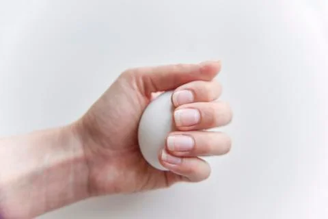 Selective focus at the white egg in the hand Stock Photos