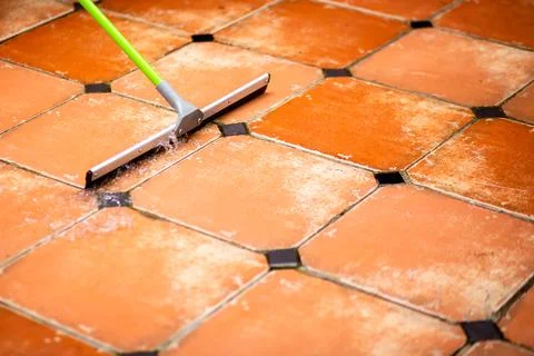 Selective focus to wiper or squeegee to clean floor surface. Cleaning floor w Stock Photos