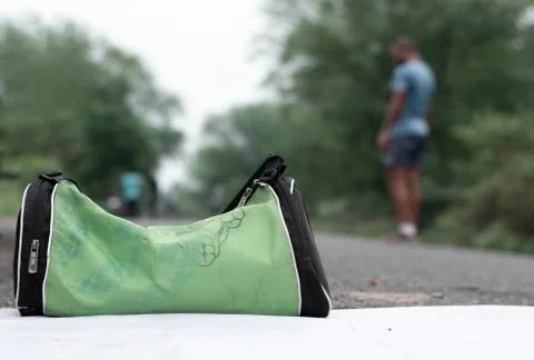 Selective focus of workout green bag meanwhile people exercising in backgroun Stock Photos