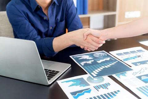 Selective focus young man handshake with someone at office Stock Photos