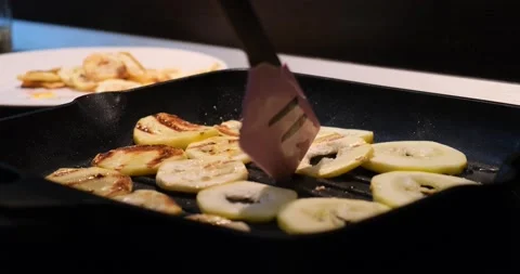 Selective focus. Zucchini slices are fried in a frying pan. Stock Footage 166025951